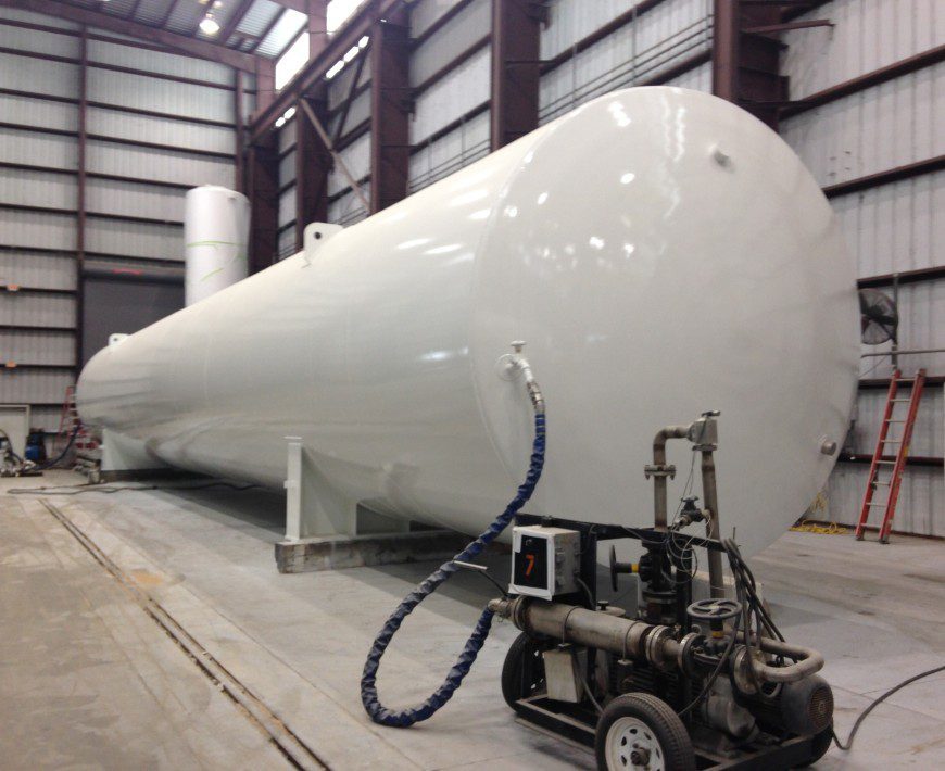 Cylindrical tank with industrial equipment
