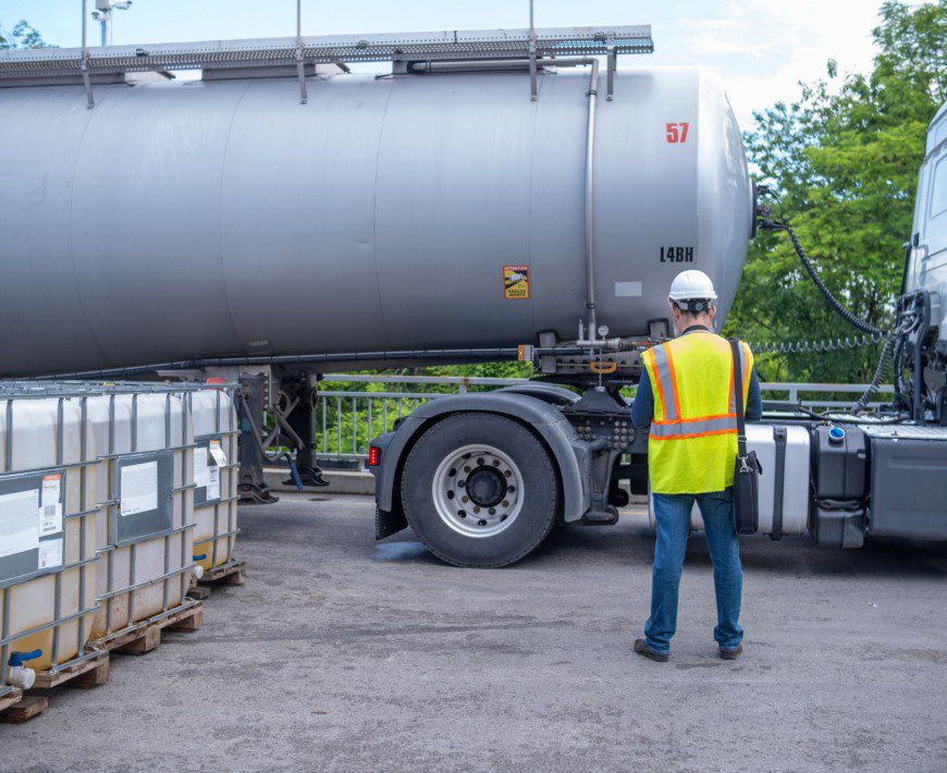Industrial worker near fuel tanker